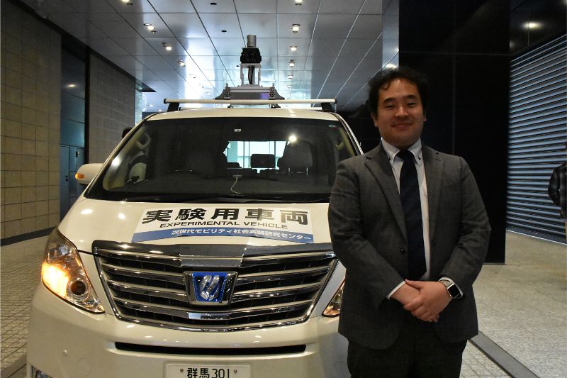 画像：NoMaps2019自動運転試乗体験会で解説する群馬大学次世代モビリティ社会実装研究センター副センター長の小木津武樹さん